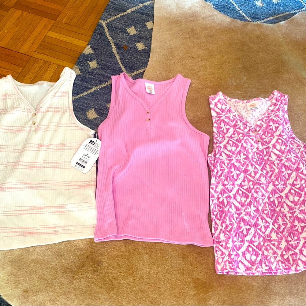 Three tank tops from wonder nation. They have never been worn and have no stain.